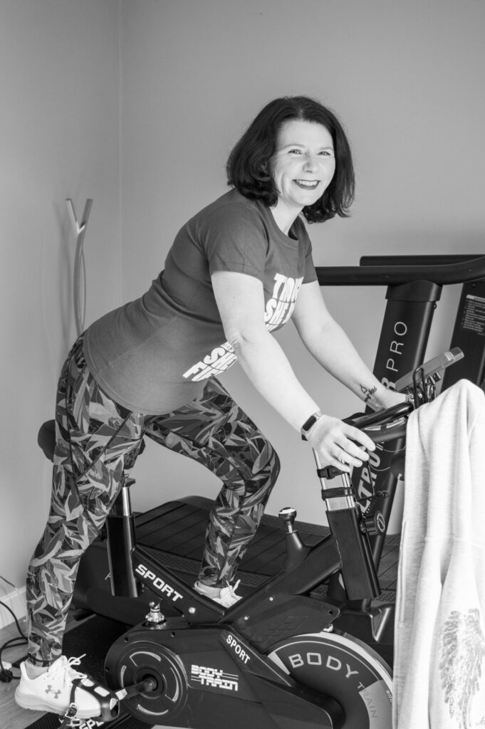 janeyhfit on exercise bike